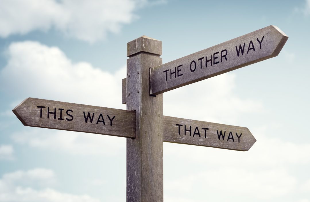 Sign with three arrows pointing in different directions